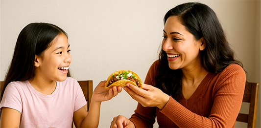 Mom and daughter sharing Birria Taco